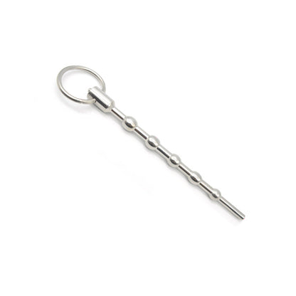 A silver-colored penis plug with a metallic finish and a small ring at the base. The plug has a series of rounded protrusions along its shaft.