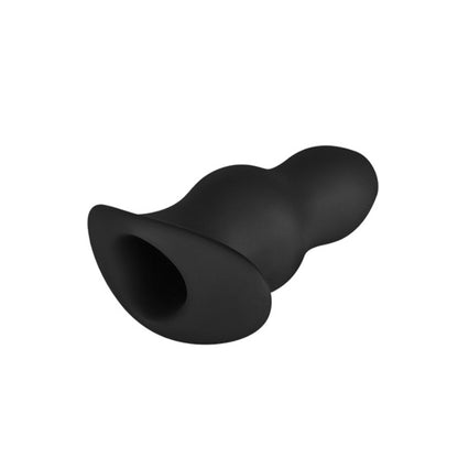 Black silicone butt plug on a white background