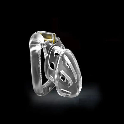 A transparent chastity device with a short cage design, featuring four interchangeable rings and a central locking mechanism.