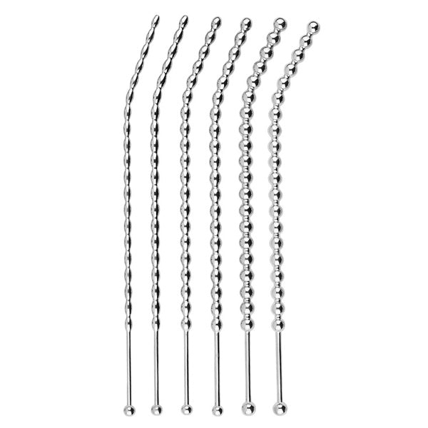 Set of urethral sounds on a white background